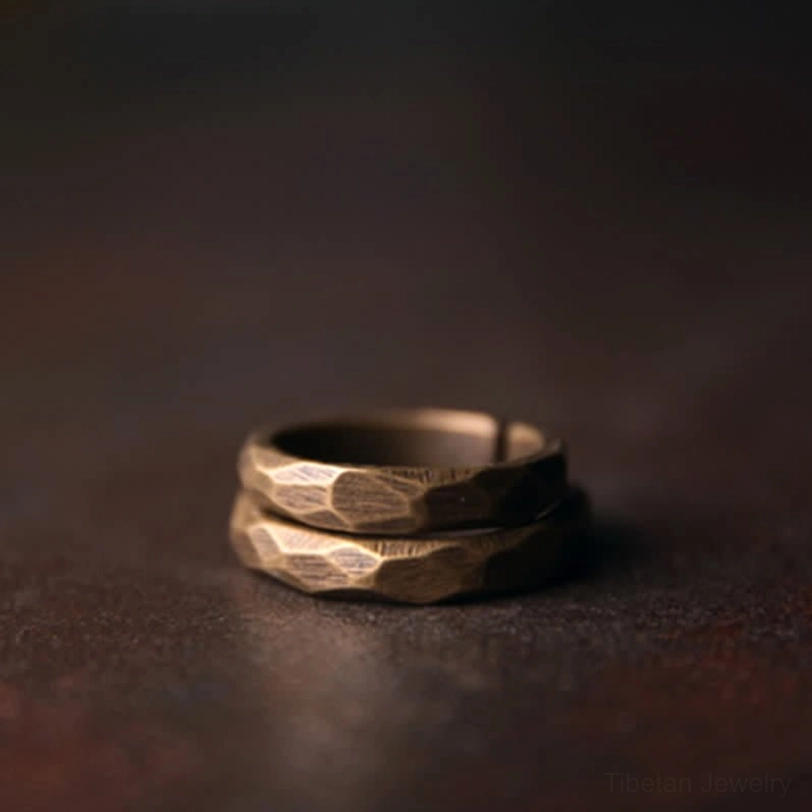 Stacked open brass copper rings front top-down antique design matching