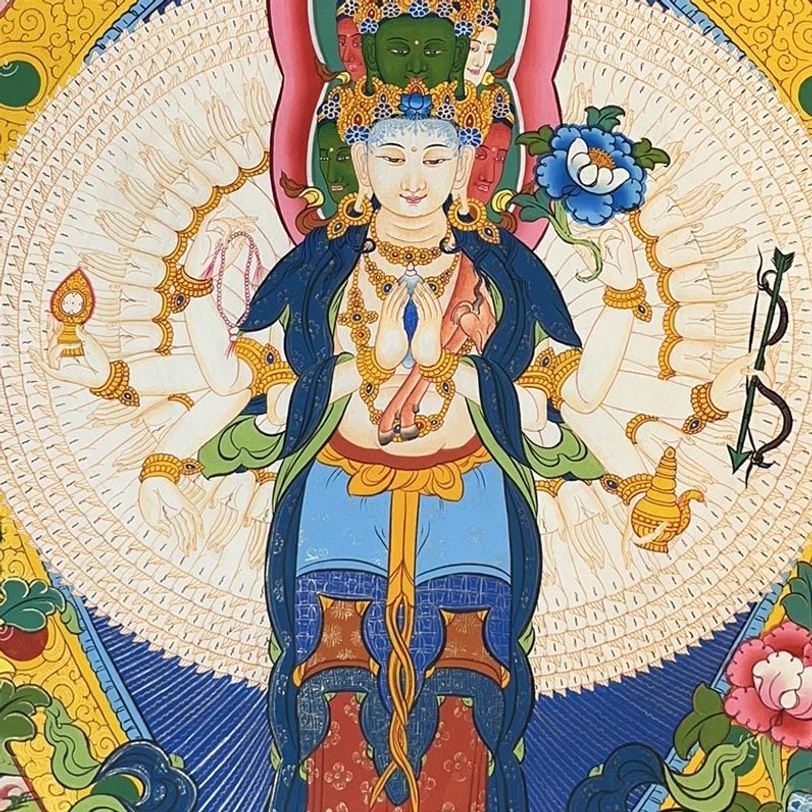 Thousand-armed Avalokitesvara thangka featuring multi-armed Buddhist deity in traditional robes with gilded halo