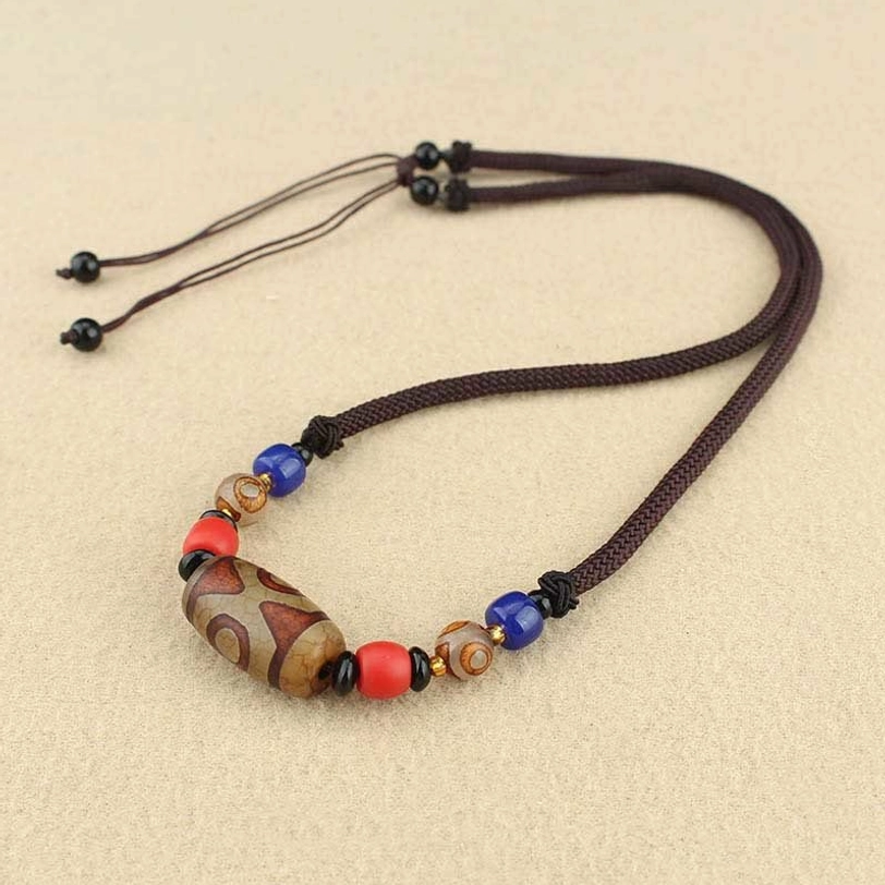 Three-eye dzi bead pendant necklace featuring hand-painted natural agate with three-eye protective symbol and colorful gemstone details