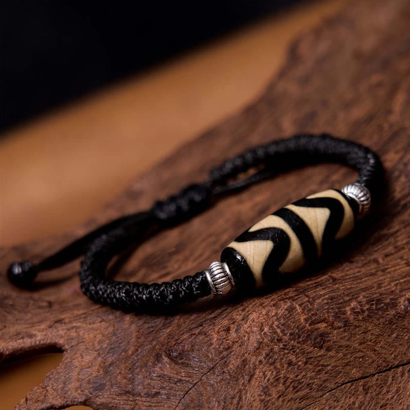 Tibetan three-eye dzi bead bracelet longevity talisman representing health harmony and life satisfaction