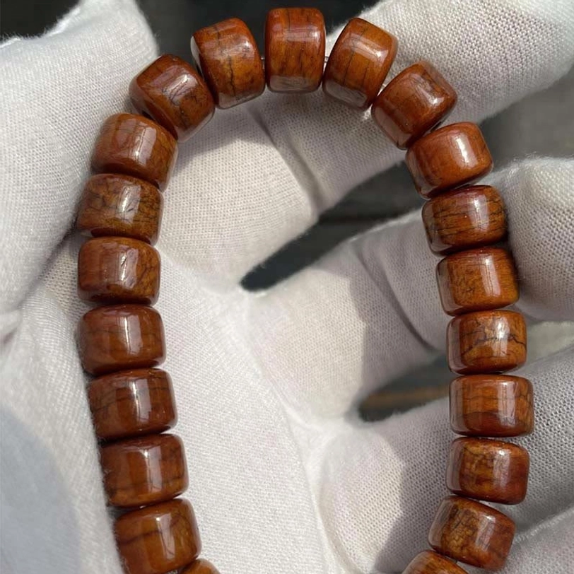Tibetan three-eyed dzi bead protective amulet detail carved stone bead