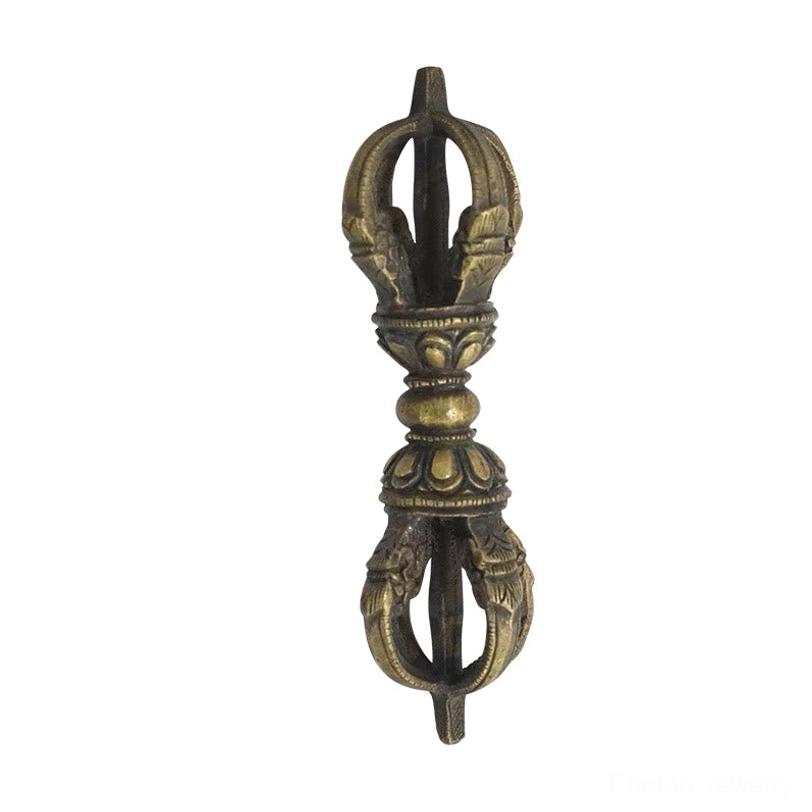 Three-prong golden Tibetan Vajra Dorje detail view showing the three jewels of Buddhism symbolism in brass finish