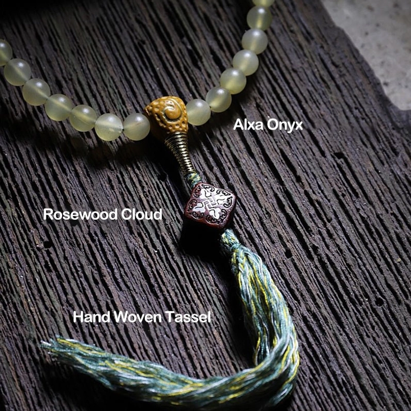 Tibetan 108 mala beads bracelet with protective spiritual significance and auspicious symbolism