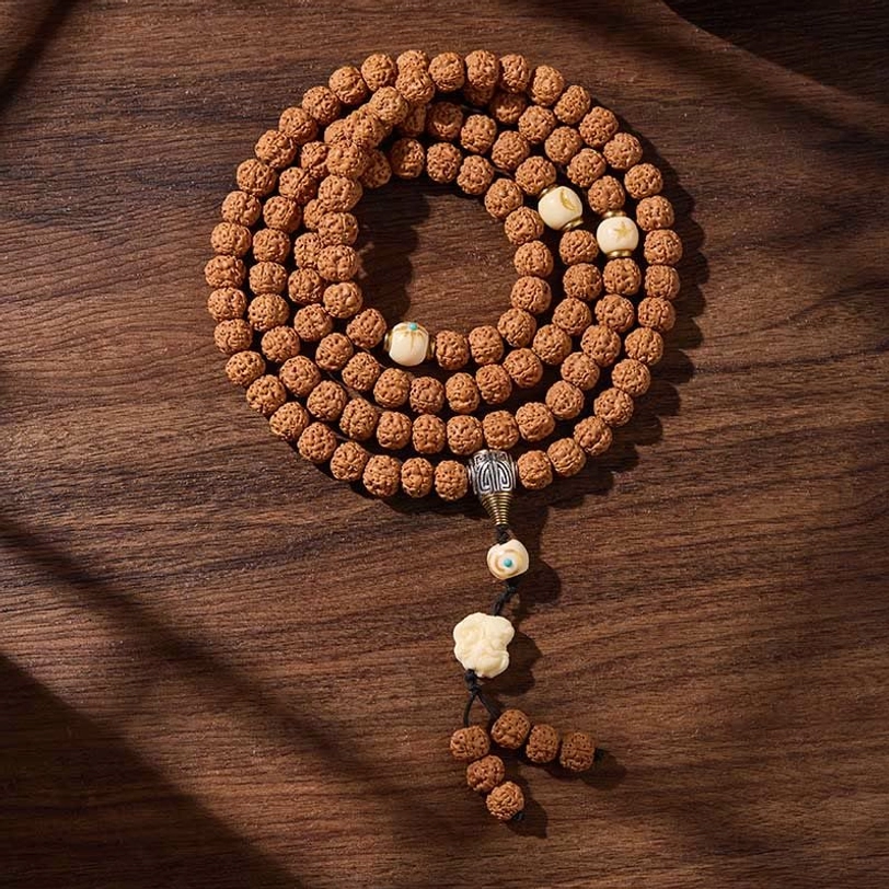 108-bead Tibetan bodhi seed prayer mala with protective three-eye dzi bead and tassel, showing complete spiritual practice tool