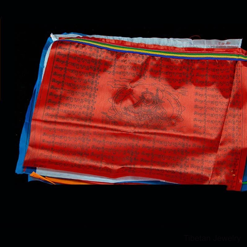 Tibetan 5-color prayer flags close-up showing traditional color symbolism blue sky white air red fire green water yellow earth