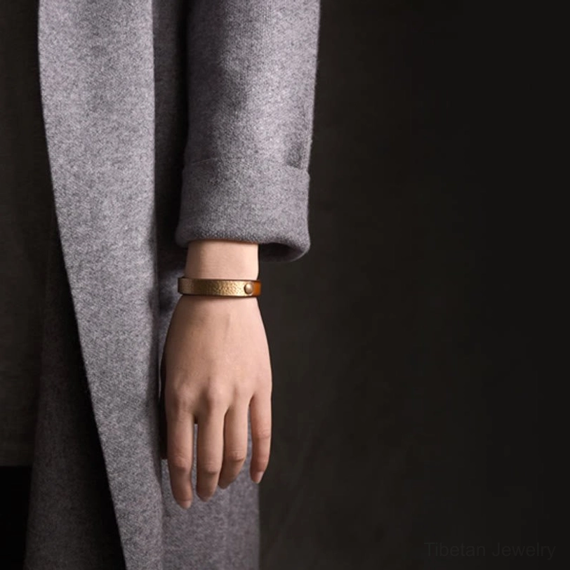 Tibetan handmade copper brass leather prosperity bracelet showing intricate artisan craftsmanship and vintage aesthetic details