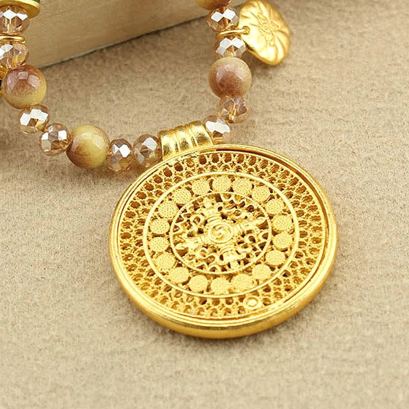 Artisan-crafted Tibetan necklace with golden tiger eye stones and carved lotus pendant