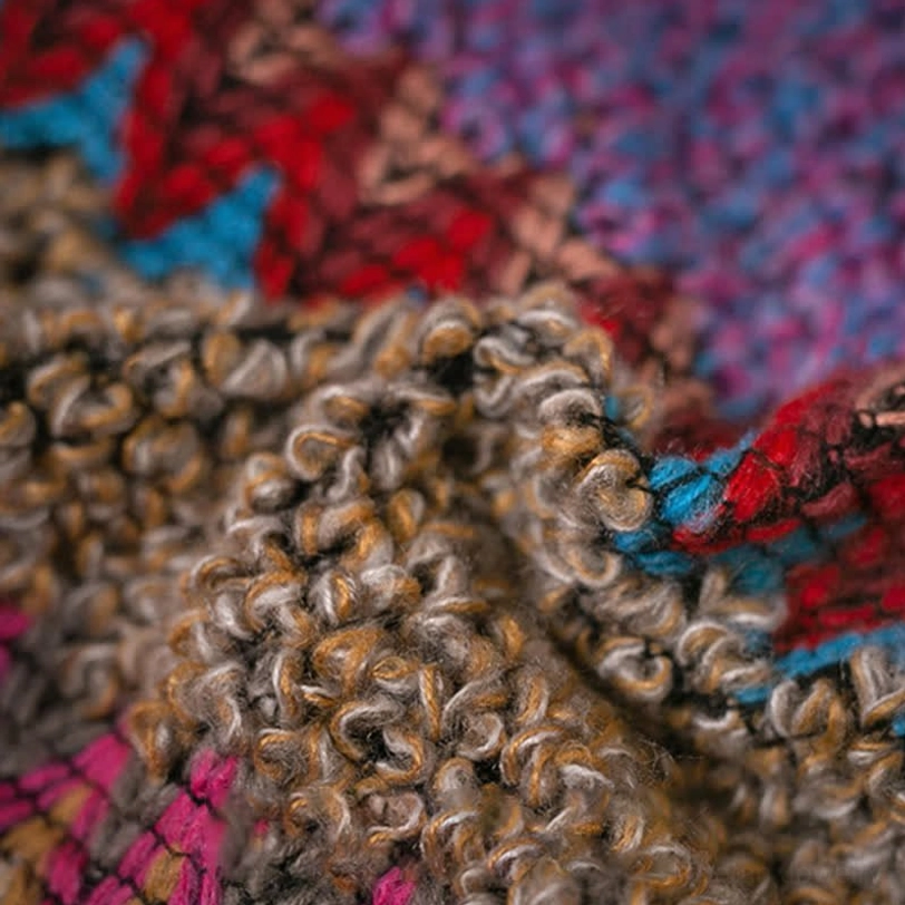 Artisanal Tibetan knitted poncho shawl showcasing traditional ethnic weaving technique and cultural heritage
