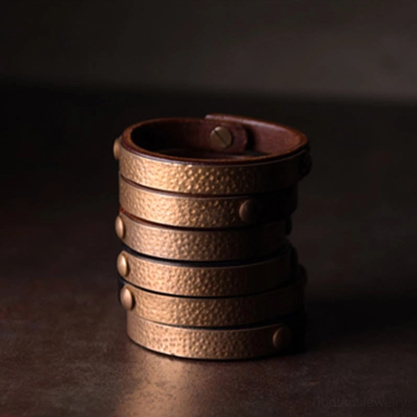 Authentic Tibetan wealth bracelet combining natural hand-dyed leather with antique brass accents, spiritual energy conductor
