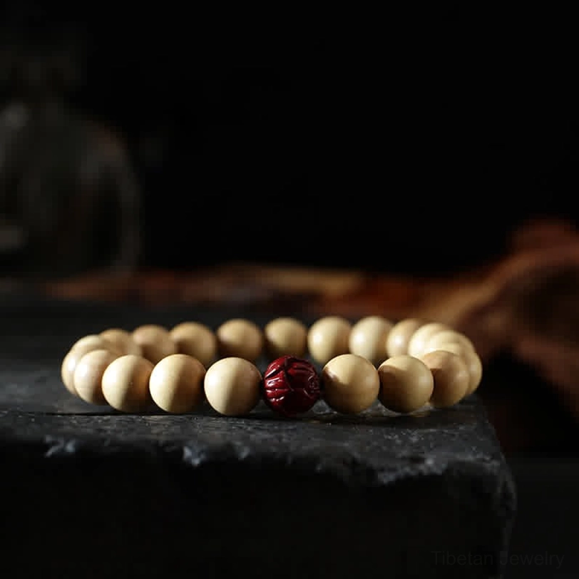 Tibetan wooden bagua bracelet detail - engraved silver spacer beads and natural peach wood beads combination