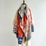 Tibetan bamboo and bird print winter scarf in red and navy blue, displayed on dress form front view