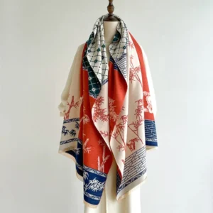 Tibetan bamboo and bird print winter scarf in red and navy blue, displayed on dress form front view