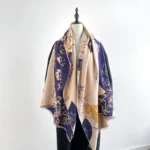 Tibetan bamboo peony reversible scarf in beige and navy on dress form - front view showing traditional handwoven pattern