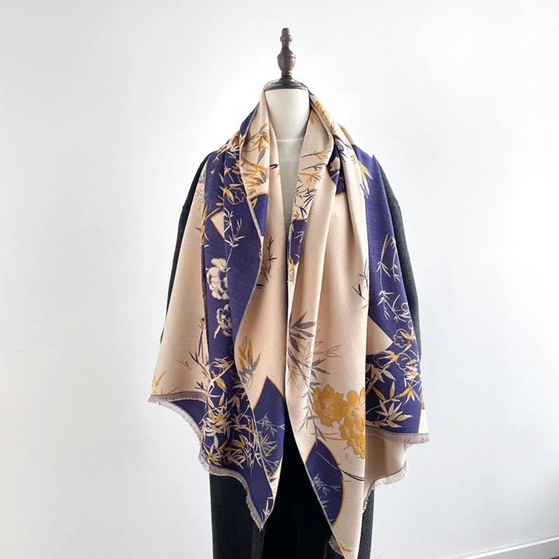 Tibetan bamboo peony reversible scarf in beige and navy on dress form - front view showing traditional handwoven pattern