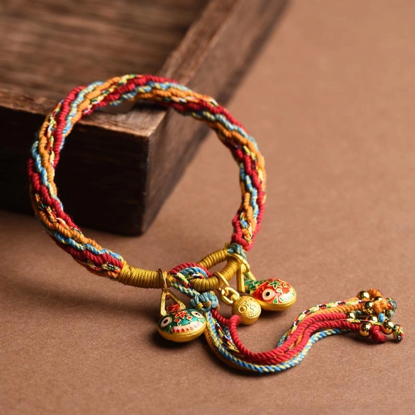 Ethnic handmade Tibetan family blessing bracelet with colorful rope and enamel protective beast charm
