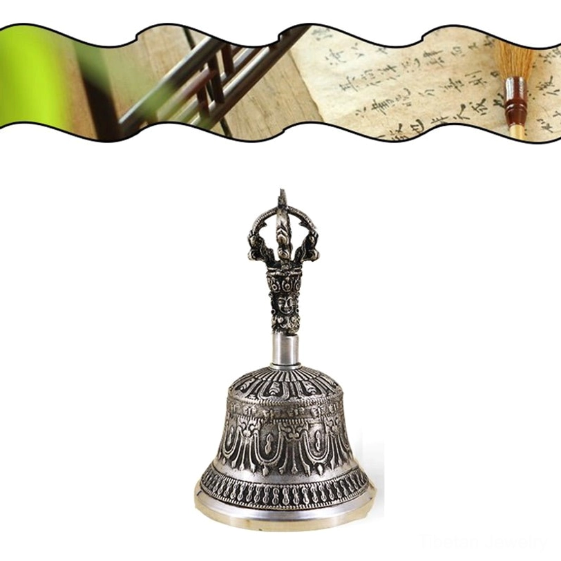 Tibetan bell and vajra dorje ritual set from above showing complete pair arrangement highlighting symmetry and spiritual balance principle