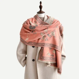 Light pink Tibetan floral bird scarf with bamboo leaf pattern worn by model, studio display