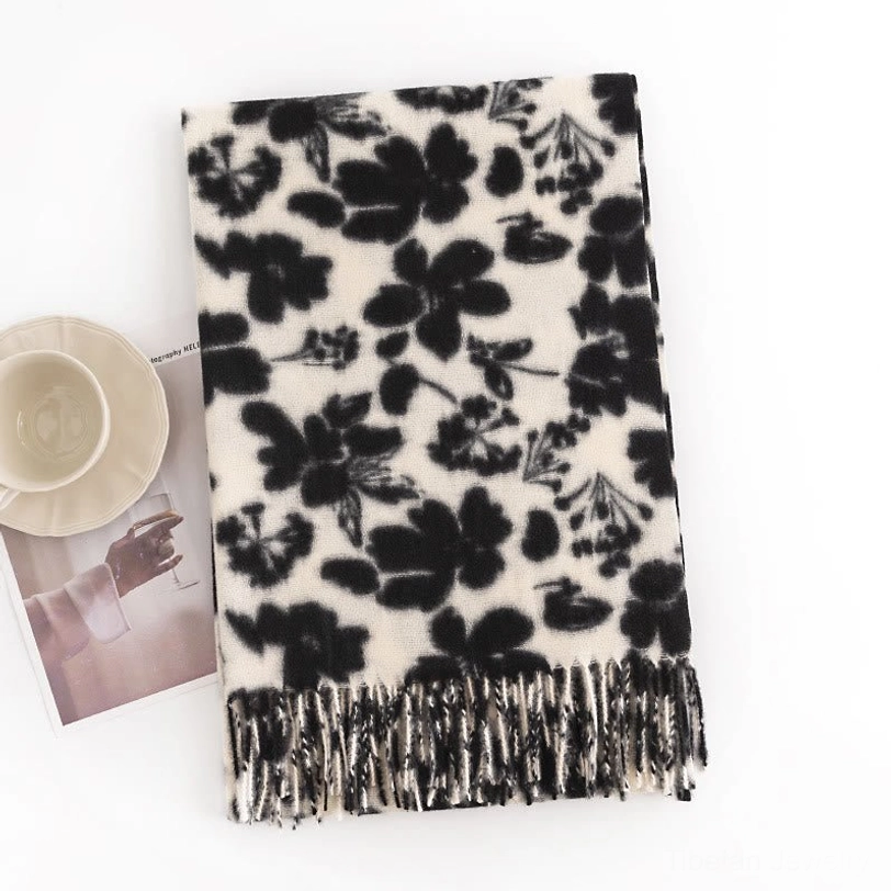 Black and off-white tibetan floral shawl flat lay, highlighting shadow flower pattern and black tassel hem