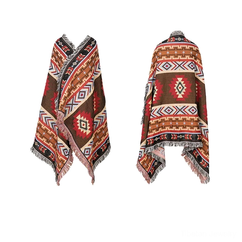 Tibetan geometric blanket color swatch showing authentic earth tones deep brown red blue accent palette