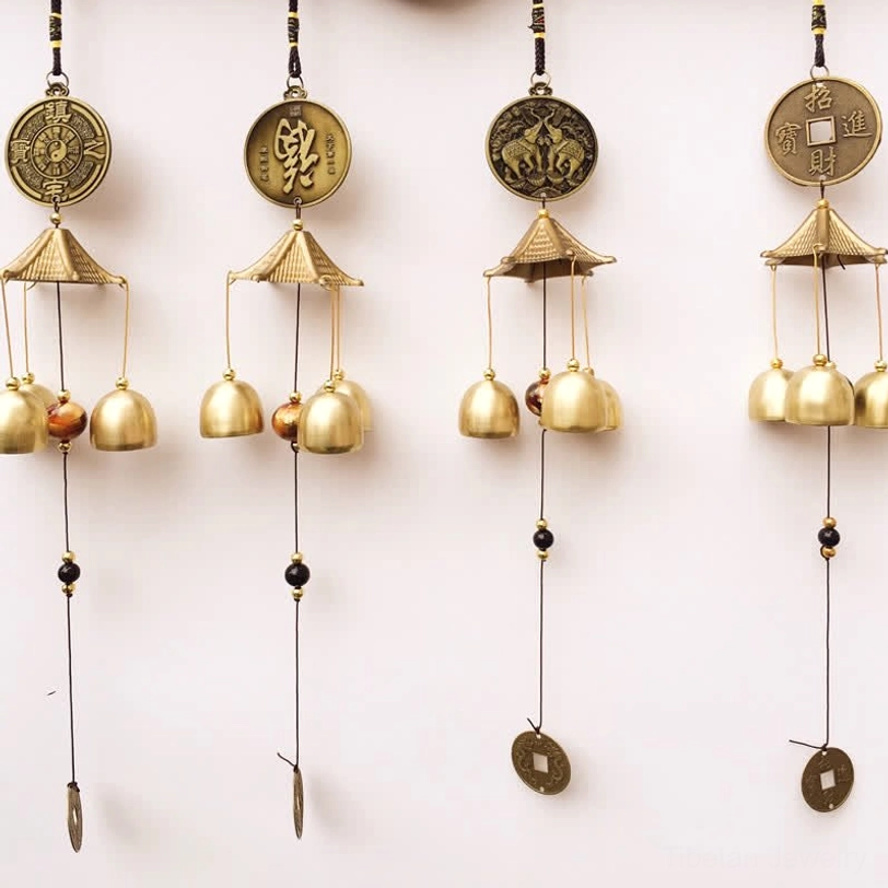 Tibetan blessing wind chimes collection with elephant, bagua, fortune coin, and fu character symbols on white background