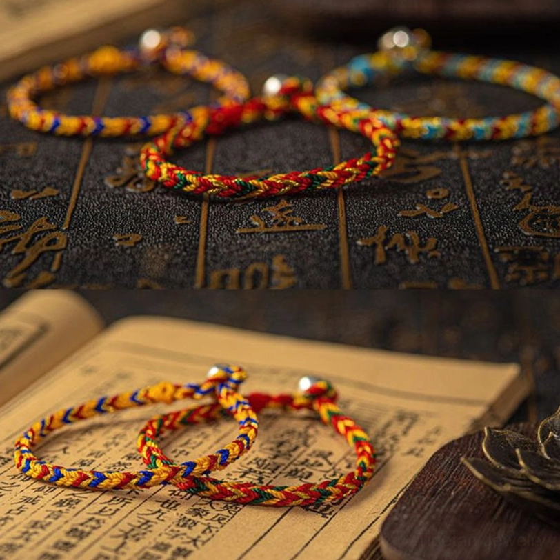 Three handcrafted Tibetan blessing bracelets in vibrant multicolors with metal clasps