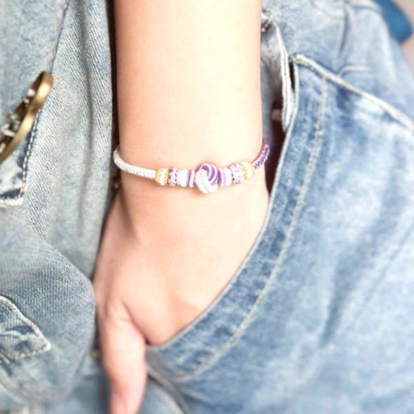 Tibetan eight-thread peace knot bracelet featuring premium natural string fibers in traditional braided pattern