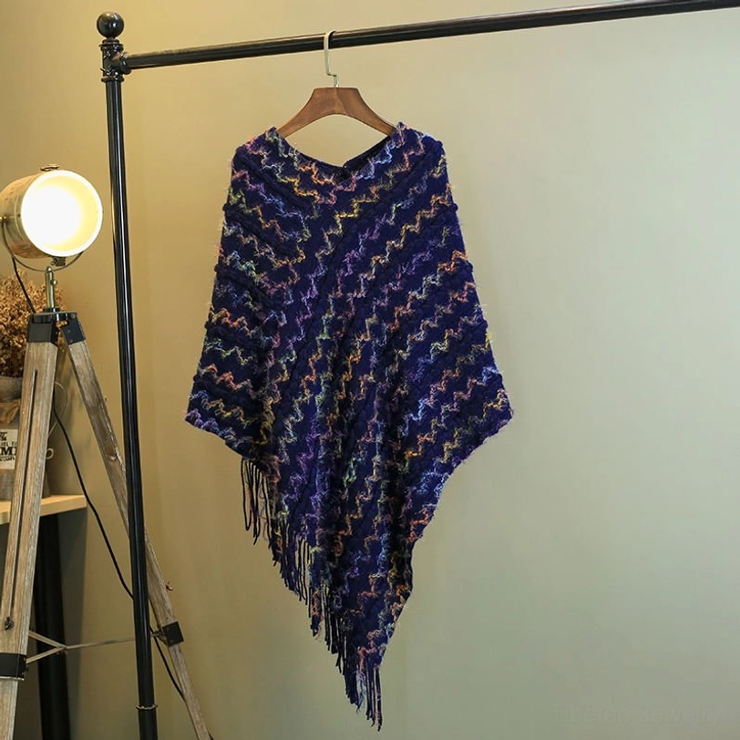 Blue tibetan striped tassel shawl poncho with spiritual symbolism and cozy knit texture
