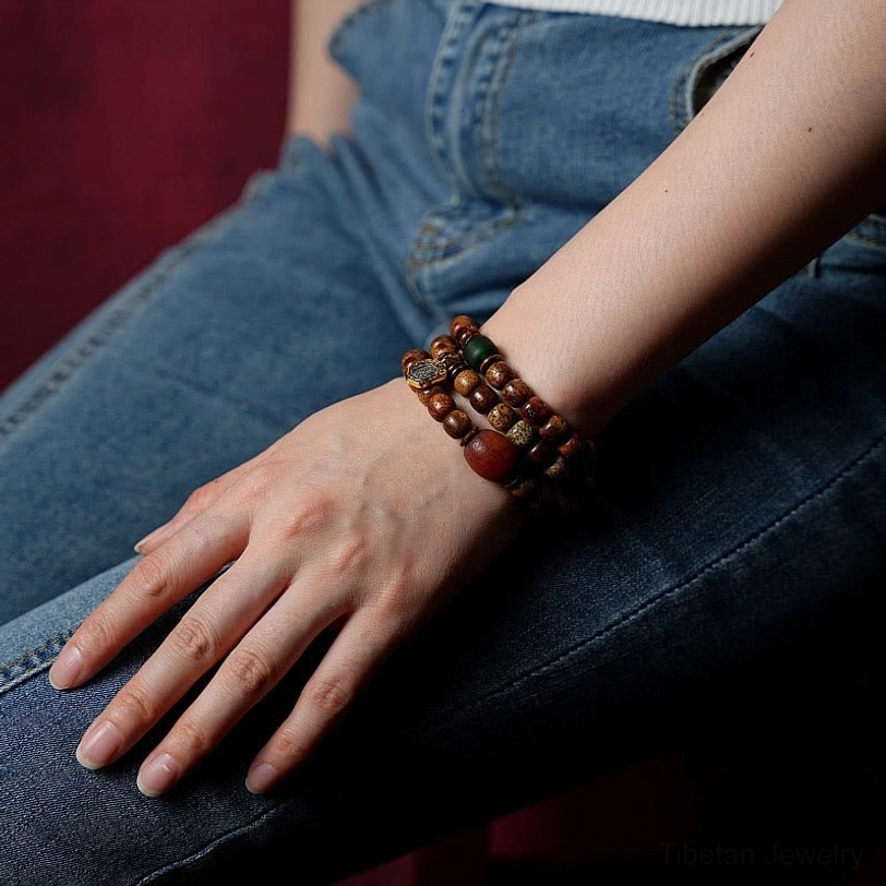 Tibetan bodhi seed bracelet with amber dzi beads and agate showing natural variations and authentic handmade craftsmanship