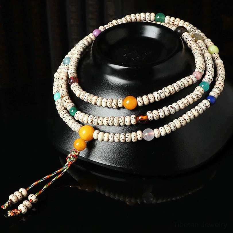 Tibetan bodhi seed amber mala bracelet with woven tassel and multilayer wrap styling