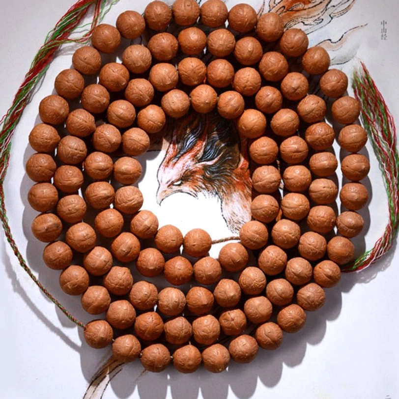 Authentic 108 Bodhi seed mala beads with multicolored woven tassel on eagle-themed spiritual background