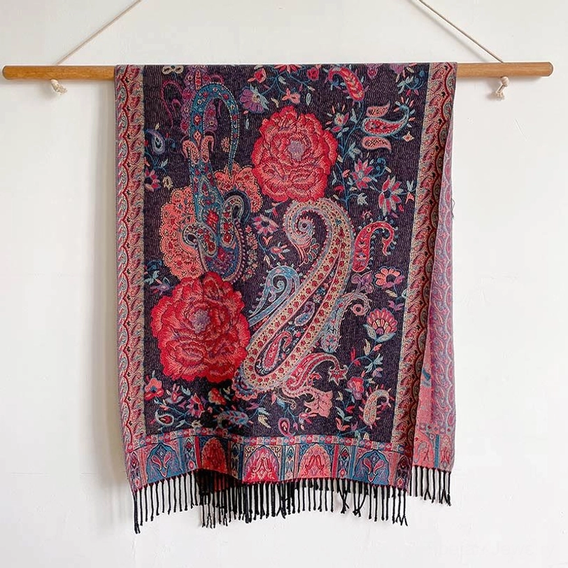 Tibetan bohemian shawl layered with contemporary fashion pieces, bridging cultural heritage with modern style