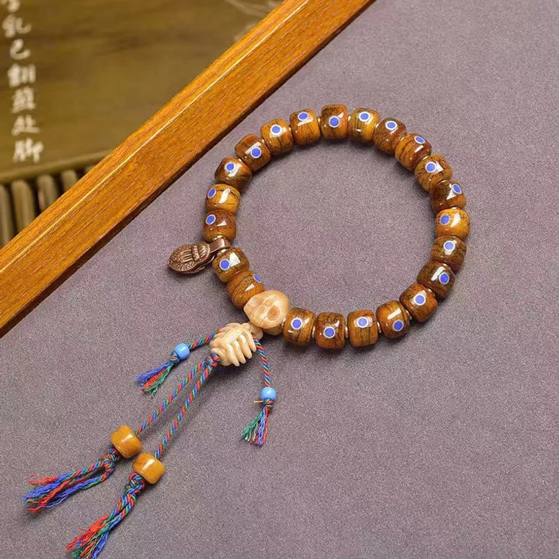 Tibetan simple bone bead bracelet with colorful woven tassel and wooden charm accents