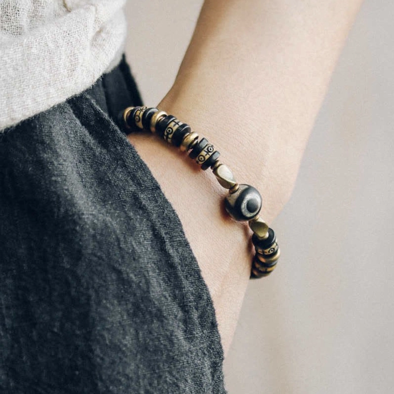 Ebony wood strength bracelet worn on wrist showing daily wear styling