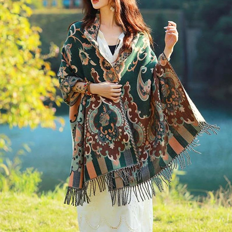 Tibetan botanical tassel shawl in bright blue color featuring traditional vine leaf and paisley patterns