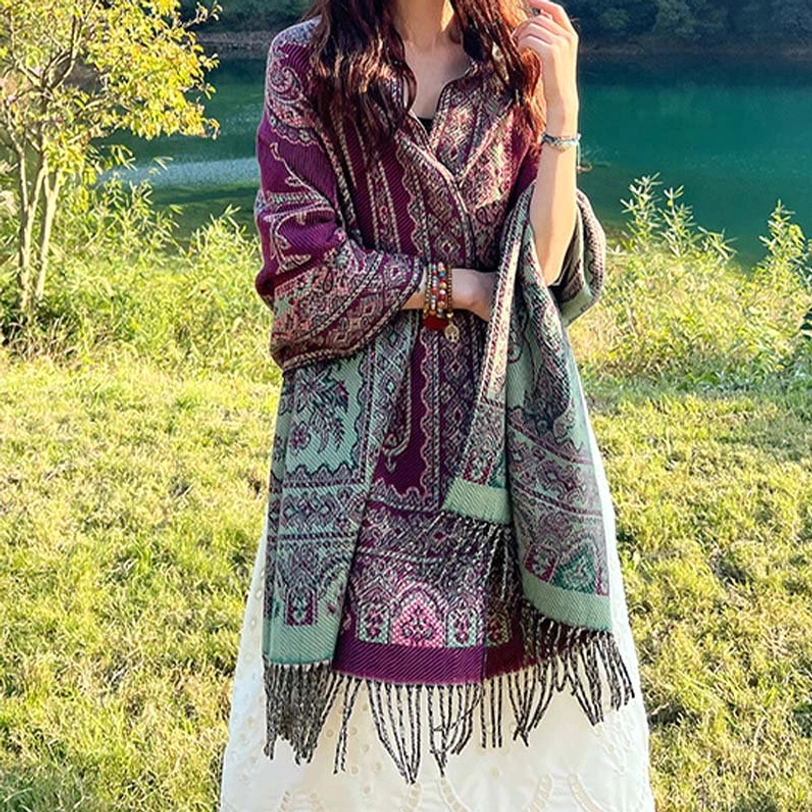 Maroon Tibetan ethnic wrap with green reverse side, woven leaf motifs and fringe hem, full front wearing shot