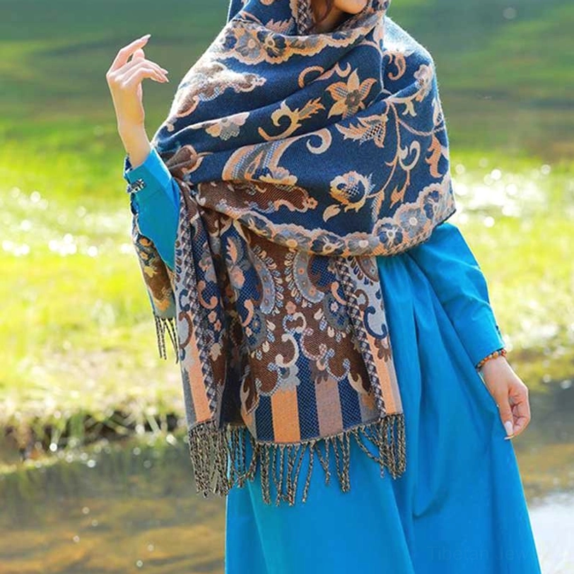 Tibetan vine leaf botanical wrap tassel shawl showing ornate jacquard pattern and traditional hemming
