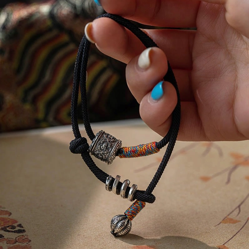Tibetan amulet bracelet adjustable fit demonstration showing wrist circumference 14-16cm sizing