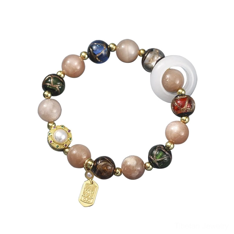 Complete Tibetan prayer wheel bracelet set showing all natural gemstone varieties and spiritual components