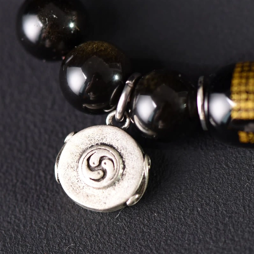 Copper metal hardware accent beads on sandalwood obsidian bracelet spiritual design