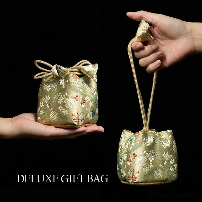 Premium embroidered brocade gift bag for Tibetan Om Mani Padme Hum bracelet with drawstring closure and floral jacquard fabric