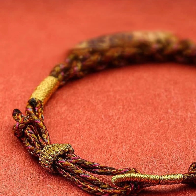 Tibetan Five God of Wealth bracelet handmade craftsmanship detail showing cord weaving
