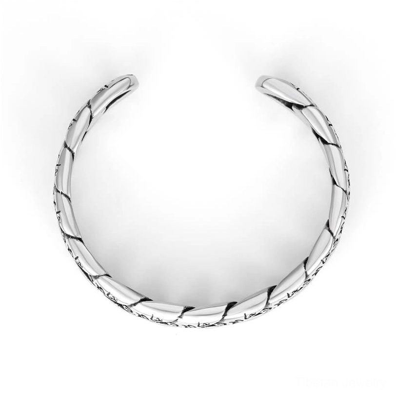 High-polish silver titanium open cuff bracelet with smooth twisted chain, front flat lay on white background