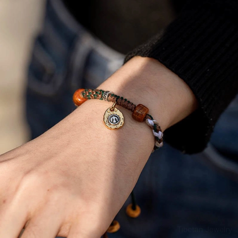 Tibetan woven bracelet featuring sustainable bone beads and traditional rope weaving technique