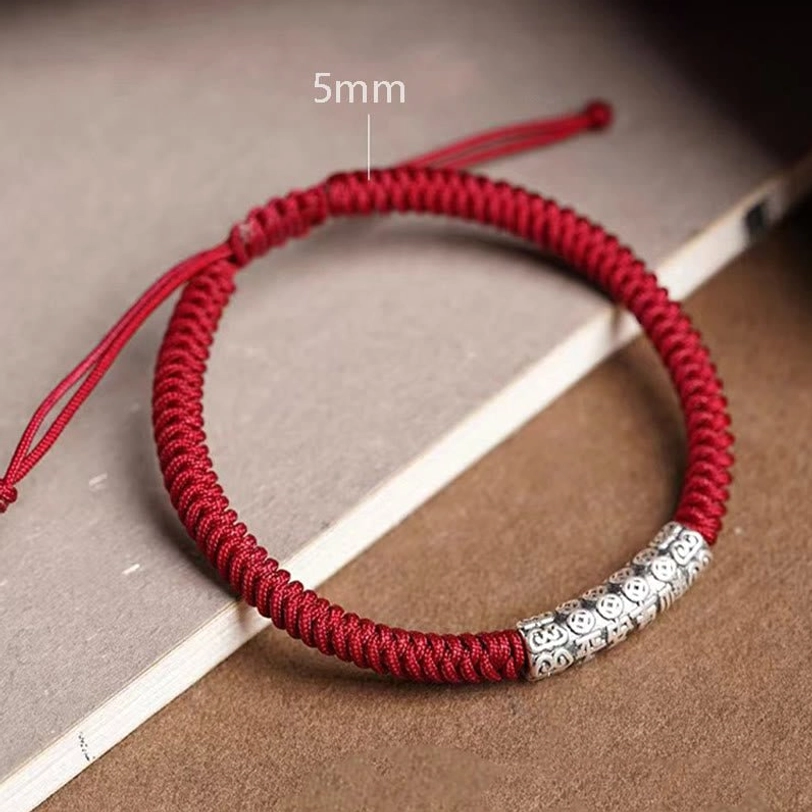 Tibetan protection rope bracelet variants displayed together showing different color options and engraved patterns