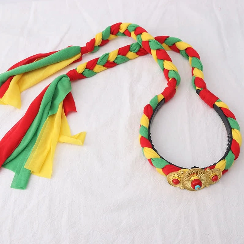 Traditional Tibetan braided hair band with yellow woven design and multiple fabric tassels