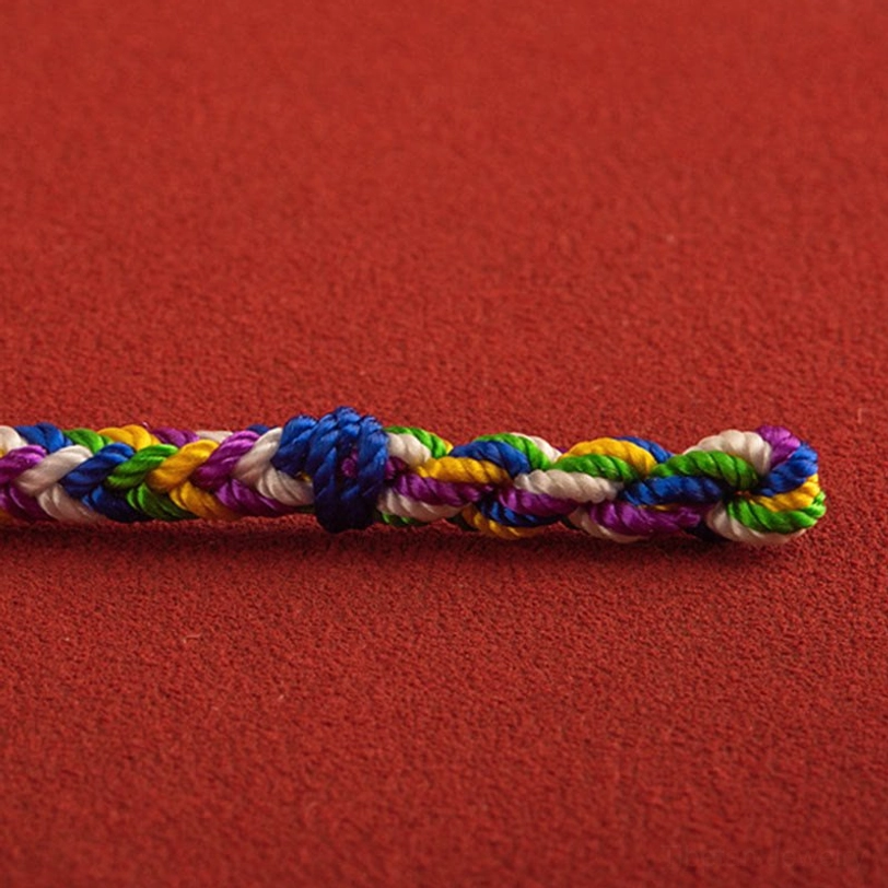 Handcrafted five-color braided bracelet strand with central knot and natural thread pattern