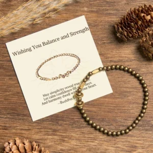 Tibetan brass couple bracelet with blessing card on wooden desktop with dried flowers and pinecones, flat lay gift set
