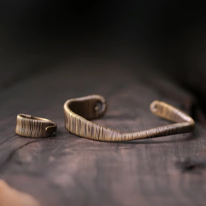 Multiple angles of Tibetan wrapped brass prosperity and protection cuff bracelet showcasing minimalist design