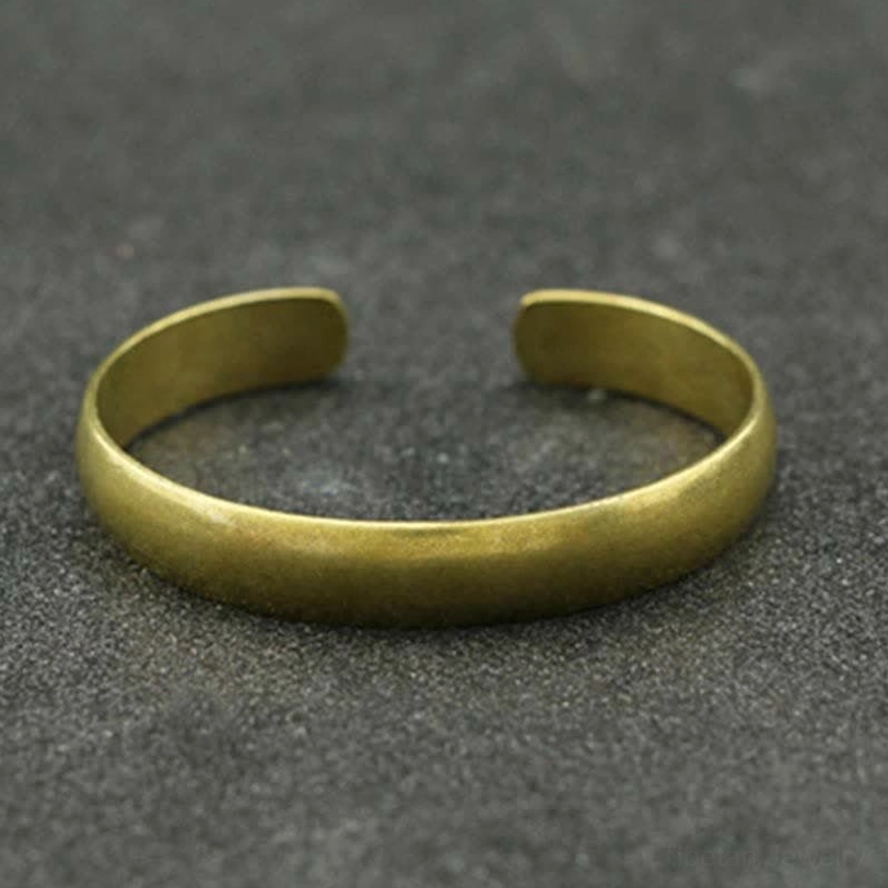 Antique bronze open cuff bracelet with smooth surface and Buddhist engraving