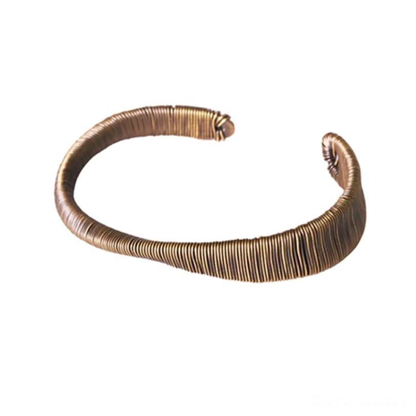 Tibetan wealth and abundance brass cuff bracelet paired with complementary spiritual accessories styling suggestion